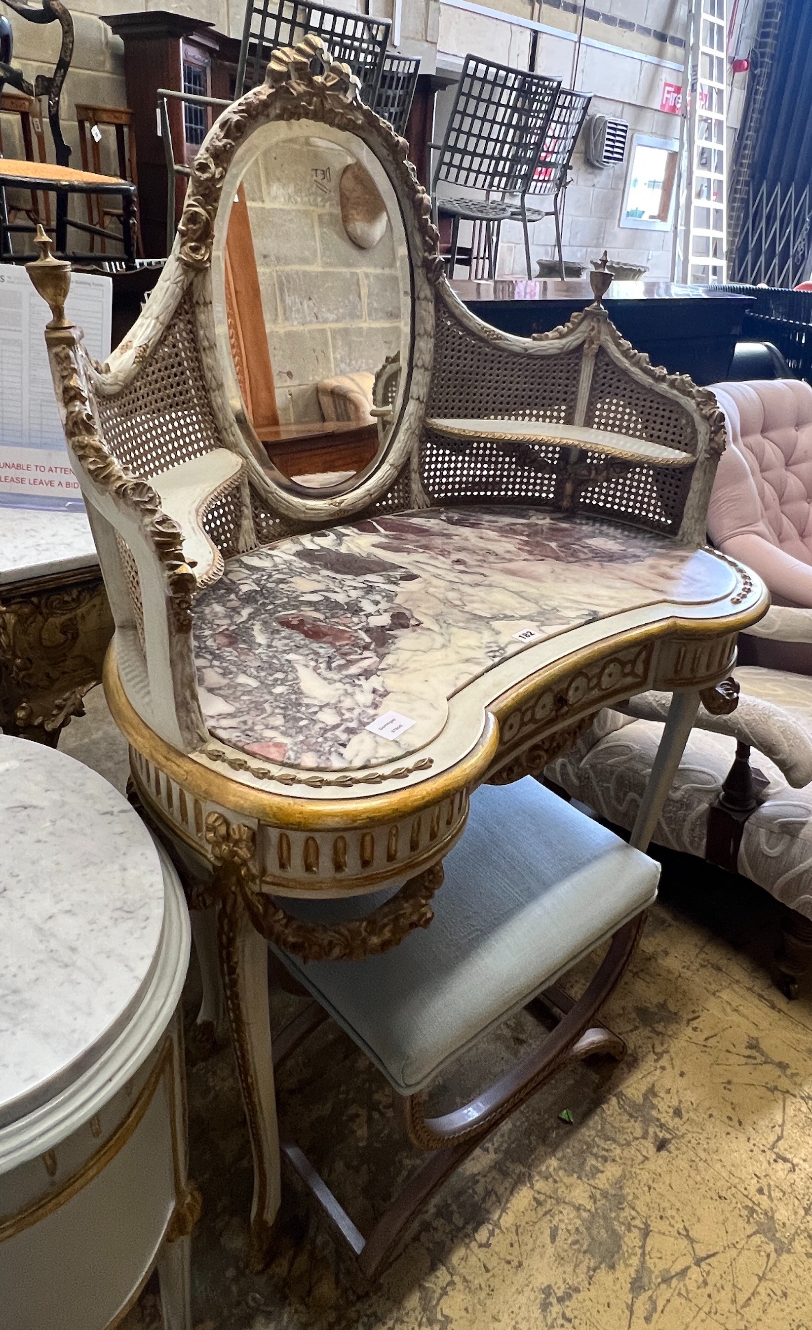 An early 20th century unusual French painted parcel gilt caned marble topped kidney shaped dressing table, width 91cm, depth 50cm, height 138cm and a stool